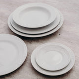 Professional Quality white Waves footed espresso cup 2 oz by Porcelain Schmidt. With beautiful texture on the edges that resemble the waves of the sea, the Waves model is the perfect match between class and versatility of white porcelain with a modern detail.