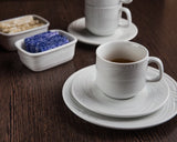 Professional Quality white Waves footed espresso cup 2 oz by Porcelain Schmidt. With beautiful texture on the edges that resemble the waves of the sea, the Waves model is the perfect match between class and versatility of white porcelain with a modern detail.