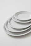 Professional Quality white Protel Platter 9 7/8 in - Set 24 by Porcelain Schmidt. Flat plates with a small flap, which gives additional resistance to the pieces.