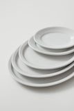 Professional Quality white Protel Platter 9 7/8 in - Set 24 by Porcelain Schmidt. Flat plates with a small flap, which gives additional resistance to the pieces.