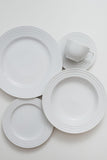 The plates and saucers have edges that intersect wider and thinner arches in high relief. The cups are round with wider and ergonomic handles. Pure design. Items bring by order.