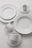 Professional Quality white Cilindrica dinner plate 10 1/4 in by Porcelain Schmidt. With flat plates, the Cilindrica model is perfect for breakfast , room service and coffee shop.